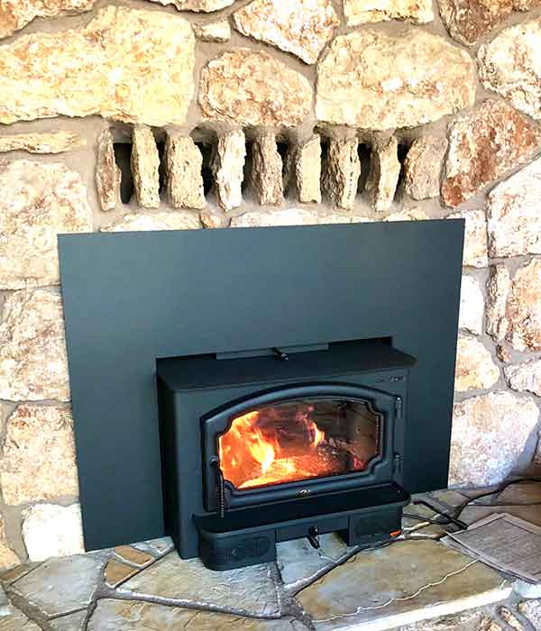 Black Chimney insert with fire burning in it